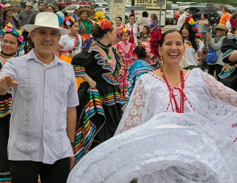 Fiesta parade showing two happy dancers